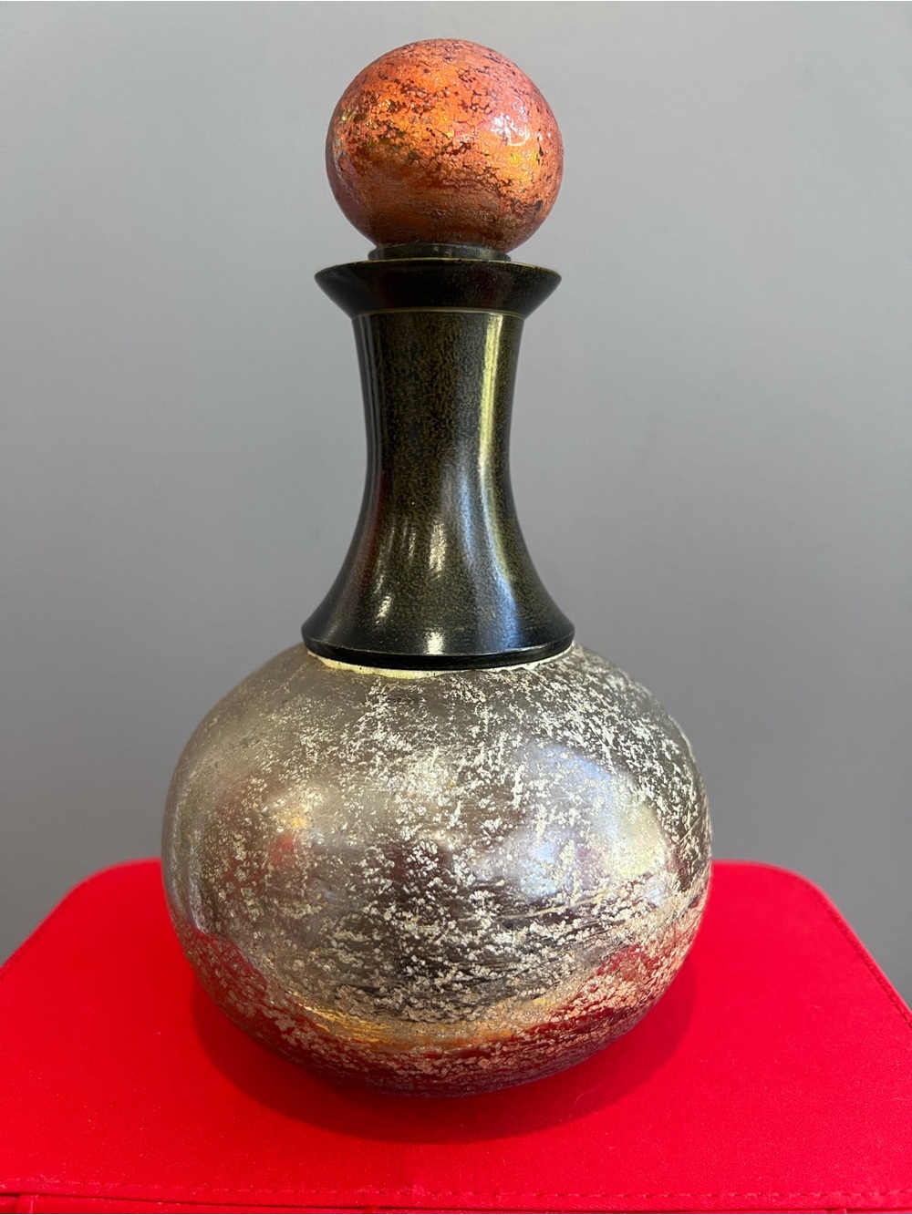 Handcrafted Decorative Glass Bottle with Orange Accent